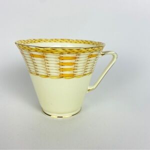 Craft on raffia bone China yellow orange basket weave single teacup.
